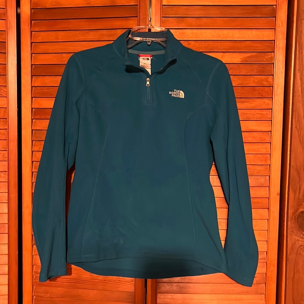 The north face turquoise pullover. Size: medium